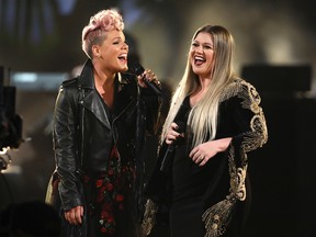 Pink, left, and Kelly Clarkson perform "Everybody Hurts" at the American Music Awards at the Microsoft Theater on Sunday, Nov. 19, 2017, in Los Angeles. (Photo by Matt Sayles/Invision/AP)