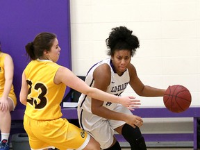 Claudia Pellerin-Olutayo, right, of Lo-Ellen Knights, drives past a Korah Colts defender during action at the senior girls NOSSA basketball final at Lo-Ellen Park Secondary School in Sudbury, Ont. on Saturday November 18, 2017. John Lappa/Sudbury Star/Postmedia Network