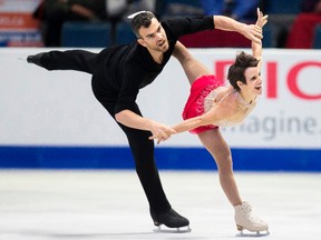 Meagan Duhamel and Eric Radford of Canada perform their free skate in the pairs competition at the 2017 Skate Canada International ISU Grand Prix event in Regina, Saskatchewan, October 28, 2017. GEOFF ROBINS/AFP/Getty Images