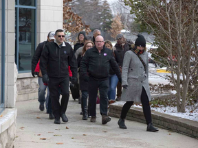 OPSEU 110 president Darryl Bedford leads a group of 10 other teachers back to work at Fanshawe College in London, Ont. on Monday November 20, 2017. Derek Ruttan/The London Free Press/Postmedia Network