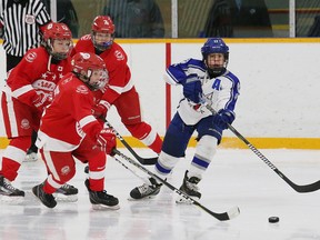 Atom Thususka, right, of the AAA Sudbury Wolves minor peewee team, passes to a teammate during hockey action against the Northside Toyota Soo Junior Greyhounds at Carmichael Arena on Nov. 18, 2017. (John Lappa/Sudbury Star)