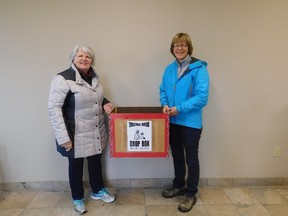 Crystal Crowley (L) and Colleen McGregor are the lead organizers of this year’s Annual Christmas Bureau in Goderich, running out of St. Peter’s Church. Seen here dropping off one of the several donation boxes around town. (Kathleen Smith/Goderich Signal Star)
