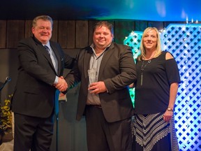 Townsend Tires accepted the Business of the Year Award. (Pictured is Mark Woodward (L), Matt Townsend and his wife Aimee (R). (Not pictured are George Townsend and his wife Ruth). (Photo courtesy of Devin Sturgeon)