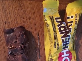 Photo taken by parent of child who reportedly on Halloween night was given a chocolate bar with sewing needle inserted into it.
(Facebook photo)