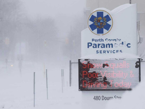 The conditions that caused snow squalls and poor visibility on local roads nearly obscured the Perth County Paramedic Services sign warning of those very conditions in this December 2016 file photo. Southwestern Ontario is in store for above average snowfall this winter, according to The Weather Network. Postmedia Network File Photo