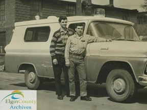 Chuck Brubacher, owner, and Butch Balsdon stand beside the Golden Acres Ambulance Service stand-by ambulance in this Times-Journal photograph taken in April 1961. Brubacher died in April 2017 and a grassroots movement has started to rename the Edward Street ambulance station after him. (File Photo // Times-Journal)