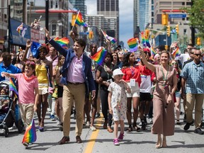Prime Minister Justin Trudeau, his wife Sophie Gregoire Trudeau and their children Ella-Grace and Xavier walk in the Pride parade in Toronto on June 25, 2017. THE CANADIAN PRESS/Mark Blinch
