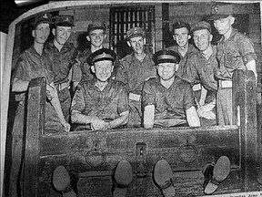 Supplied photo
A Whig-Standard photo supplied by Kingston historian Jennifer McKendry shows Canadian military personnel posing inside a stock at Fort Henry in the late 1950s.