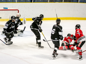 Sarnia Legionnaires forward Trevor Bogaert (No. 16 in red) scores with a drive from between the faceoff circles during his team's last home game. The squad returns home Thursday when it hosts the St. Marys Lincolns. Photo courtesy of Shawna Lavoie.