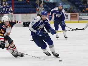 Ryan Valentini, right, of the Sudbury Wolves, skates around Justin Murray, of the Barrie Colts, during OHL action at the Sudbury Community Arena in Sudbury, Ont. on Friday March 10, 2017. John Lappa/Sudbury Star/Postmedia Network