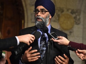 Minister of National Defence Harjit Sajjan speaks to reporters in the foyer of the House of Commons on Parliament Hill in Ottawa. (Justin Tang/The Canadian Press)