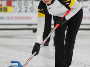 Michaela Downey, the second for the New Brunswick women’s team, sweeps a rock during a game against Ontario in the Travelers Curling Club Championships at Cataraqui Golf and Country Club on Tuesday. (Julia McKay/The Whig-Standard)