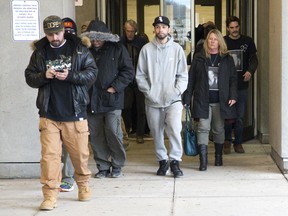 Several people wore t-shirts featuring an image of Cody Andrews to the sentencing hearing of Scott Altiman in London, Ont. on Tuesday, November 21, 2017. (DEREK RUTTAN, The London Free Press)
