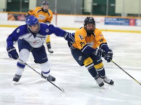 Avery Chisholm of the Sudbury Wolves minor midget AAA battles for the puck with Daniel Kalfus of the North Central Predators during midget first day action at the 38th annual Big Nickel Hockey Tournament in Sudbury, Ont. on Thursday November 2, 2017. Gino Donato/Sudbury Star/Postmedia Network