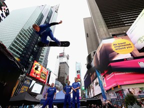 Chatham This Week columnist Karen Robinet, in New York recently, writes she quickly tired of the big city and pined for the slower pace of small-town Ontario. This photograph shows a member of Team USA in Times Square on Nov. 1.