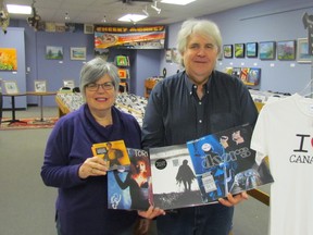 Mary Anne and Roland Peloza, owners of Cheeky Monkey, show a few of the special releases that will be available at the record store in downtown Sarnia during this week's Record Store Black Friday event. More Canadian retailers are joining in on the U.S. Black Friday holiday shopping tradition. (Paul Morden/Sarnia Observer/Postmedia Network)