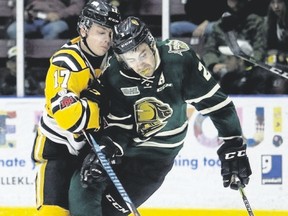 Sting forward Drake Rymsha collides with London Knights defenceman Evan Bouchard during the first period of their OHL game at Progressive Auto Sales Arena in Sarnia on Wednesday night. The Sting won 4-1. (Mark Malone/Postmedia News)
