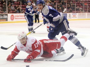 Soo Greyhounds winger Keeghan Howdeshell, tailed by Sudbury Wolves defenceman Doug Blaisdell, takes a spill while trying to control the puck during first-period OHL action Wednesday, Nov. 22, 2017 at Essar Centre in Sault Ste. Marie, Ont. Jeffrey Ougler/Postmedia Network