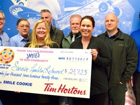 Tim Hortons stores in Sarnia and Bright’s Grove have given an almost $25,000 donaton to Sarnia-Lambton Rebound. Store owners are Richard Ponic, Greg Boyle, David Hogen, Dennis Jutzi, Sarah Best Shawn Poirier and Justin Walker with Rebound Executive Director Carrie McEachran. Not pictured: Paula Jutzi, Julie Poirier, Josie Brooks and Dan Portiss. (Melissa Schilz/Postmedia Network)