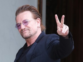 U2 singer Bono makes a peace sign while in Paris on July 24, 2017. (Michel Euler/The Associated Press)