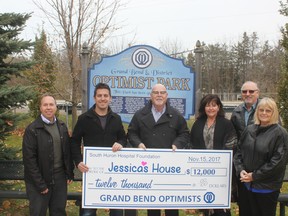 Part of the proceeds from the 2017 Grand Bend Optimist Club Summer Festival was earmarked for Jessica’s House residential hospice. Here Optimist member Jim Quenville (L)with president Scot Musser  hand over $12,000 to Jessica’s House steering committee members Pat O’Rourke, Lori Baker, David and Laura Lee Marshall on November 15th at the Optimist Park. (Lynda Hillman-Rapley/Lakeshore Advance)