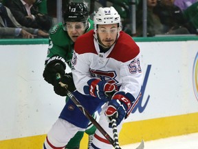 Montreal Canadiens defenseman Victor Mete (53) and Dallas Stars center Mattias Janmark (13) skate for the puck during the first period of an NHL hockey game in Dallas, Tuesday, Nov. 21, 2017. (AP Photo/LM Otero)