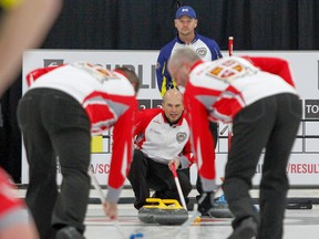 Newfoundland skip Andrew Symonds calls hurry hard to sweepers Keith Jewer and Dave Noftall during the last day of the round robin at the Travelers Curling Club Championship at the Cataraqui Golf and Country Club in Kingston, Ont. on Thursday November 23, 2017. (Julia McKay/The Whig-Standard)