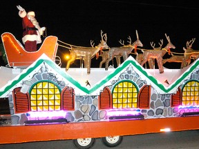 Santa waves to the thousands of fans who waited for him along Dundas street in the annual Santa Claus parade in London on Saturday, Nov. 13, 2010. (Free Press file photo)