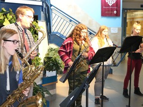 BRUCE BELL/THE INTELLIGENCER
Pictured is St.Theresa Catholic Secondary School music teacher Cory Diening’s wind ensemble band entertaining students outside the school}s Great Hall during Wellness Week on Thursday. Pictured from left to right are Maddy Bashall, Diening, Amanda Delyea van Boxtel, Josalyn Flindall and Miriam Brownlee.