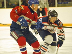 Rayside-Balfour Canadians' Jacob Partridge battles for the puck with a Soo Thunderbirds player during NOJHL action at Chelmsford Arena on Thursday. The Canadians lost 3-2. Keith Dempsey/For The Sudbury Star