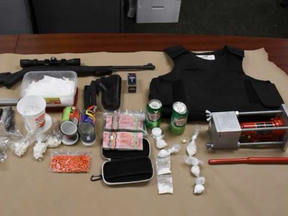 A London police raid seized fentanyl, guns, a bulletproof vest and cash on Thursday.