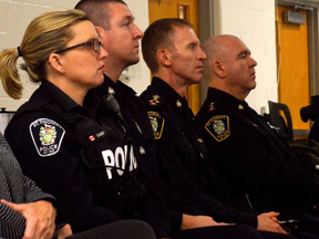 From left, Const. Tanya Calvert, Const Marc Roskamp, Chief Chris Herridge, and Insp. Hank Zehr sit at attention during a crowded community meeting about opioid abuse Thursday night. Their goal is to inform people about opioid addiction and abuse, so to limit overdoses in the area.