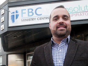 First Baptist Church Pastor Steve Amorin, on Broadway, in front of the church's new (and temporary) FBC Ministry Centre. (Chris Abbott/Tillsonburg News)