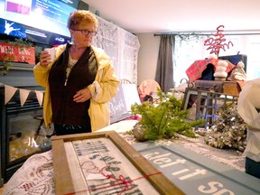 Lois Day browses the upcycled decor products available at Stix 'N Skids Saturday afternoon during the 21st Welcome Back to Otterville Studio Tour. Day has been 'coming back to Otterville' from London for more than 15 years.
Chris Abbott/Tillsonburg News
