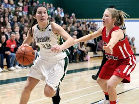 Amanda Palocz, left, of the St. Patrick's Fighting Irish drives to the basket against Northern Vikings' Cassidy Hirtle in the first half of the LKSSAA AAA senior girls' basketball final at St. Patrick's Catholic High School in Sarnia, Ont., on Saturday, Nov. 11, 2017. (Mark Malone/Postmedia Network)