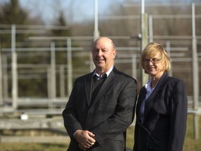 Wayne and Anna Hocking stand amid the Western radar array on Wonderland Road north of London. The husband and wife research team has developed a tornado-prediction method using a network of radars built to study winds and turbulence in the upper atmosphere. (MIKE HENSEN, The London Free Press)