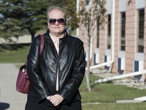 Elisa Kilbourne stands outside the Stoneridge Inn in London, where an inquest into the death of her son ended Friday. Her son, Jeremy Bowley, 21, was electrocuted in a workplace accident in 2013. (DEREK RUTTAN, The London Free Press)