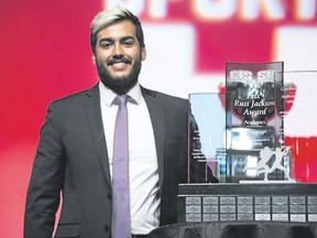 Western Mustangs linebacker Nick Vanin accepts the Russ Jackson Award for student-athlete community service Thursday in Hamilton. (The Canadian Press)