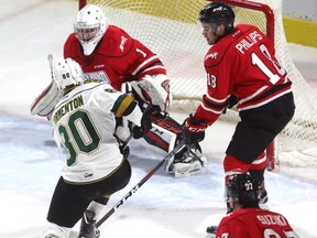 Alex Formenton ties the game up scoring from the slot in front of Owen Sound's Mack Guzda, on a perfect feed from captain Robert Thomas while Markus Phillips of Owen Sound moves in. The goal made the score 1-1 during the first period of their game at Budweiser Gardens on Friday November 24, 2017.  The Knights led 3-1 after the first. (MIKE HENSEN, The London Free Press)