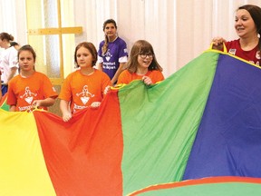Olympians Tessa Bonhomme, left, and Brittany MacLean take part in an activity with MacLeod Public School students Maija Makela, second left, Lily Rose Burwell and Elle Luoma at the Jumpstart games for girls at Laurentian University in Sudbury, Ont. on Friday November 24, 2017. John Lappa/Sudbury Star/Postmedia Network