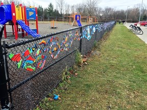 Submitted Photo
A row of painted fish adorn the chainlink fence outside Stirling Public School. The "dream fish" were painted by students and placed on the fence as part of the Stream of Dreams program