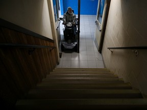 Tim Miller/The Intelligencer
Local resident Bill Seeley sits in his electric scooter at the base of the stairs leading up to the second floor of the Stirling-Rawdon and District Recreation Centre. The upper floor, which is rented out for a variety of community activities, currently has no accessibility options for people with mobility issues.