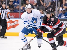 Belleville's Filip Chlapik and Toronto's Martin Marincin battle for the puck during AHL Battle of Ontario action Saturday at the ACC. (Belleville Senators photo)