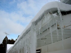 Steve Maxwell/For The Sudbury Star
Too much rooftop heat loss leads to ice dam formations like this one. Boosting attic insulation and ventilation is one solution, but sometimes you need heating cables to get the job done.
