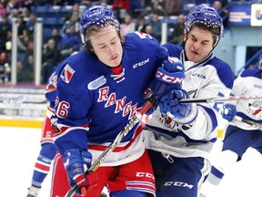 Darian Pilon of the Sudbury Wolves and Cole Carter of the Kitchener Rangers collide during OHL action against the Kitchener Rangers in Sudbury, Ont. on Sunday November 26, 2017. Gino Donato/Sudbury Star/Postmedia Network