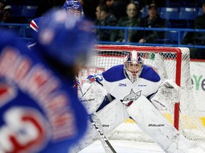 Sudbury Wolves goalie Mario Culina keeps his eye on the puck during OHL action against the Kitchener Rangers in Sudbury, Ont. on Sunday November 26, 2017. Gino Donato/Sudbury Star/Postmedia Network