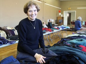 Ann Lyng, co-ordinator of ministries at St. Mary's Cathedral, at the Hotel Dieu Hospital-St. Mary's Cathedral Coat Drive in the church's Parish Hall on Friday. (Steph Crosier/The Whig-Standard)