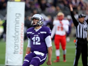 Western Mustangs quarterback Chris Merchant celebrates after running in a touchdown on the Mustangs? first drive of the game. Merchant was named Vanier Cup MVP. (MIKE HENSEN, The London Free Press)