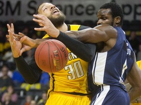 London Lightning's Royce White is fouled by Rhamel Brown of the Halifax Hurricane under the basket during the Lightning's home opener on Sunday November 26, 2017 at Budweiser Gardens. The Lightning won 112-99. (MIKE HENSEN, The London Free Press)