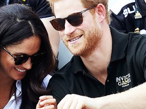 Prince Harry (R) and Meghan Markle (L) attend a Wheelchair Tennis match during the Invictus Games 2017 at Nathan Philips Square on September 25, 2017 in Toronto, Canada (Photo by Chris Jackson/Getty Images for the Invictus Games Foundation )
